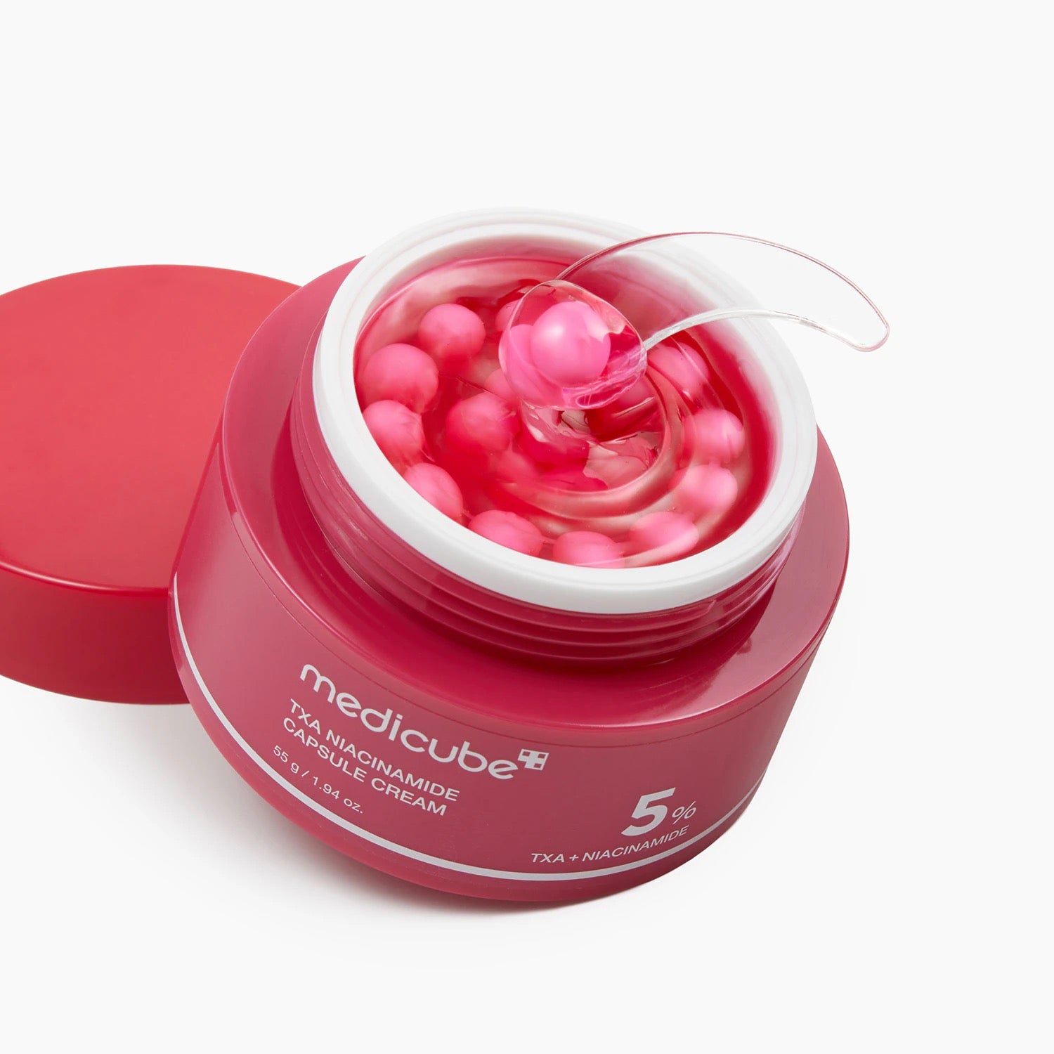 Crème visage anti-taches aux capsules de TXA 99 %, niacinamide 5 %, alpha-arbutine et glutathion.